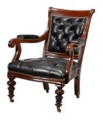 A Victorian mahogany and black leather upholstered library armchair