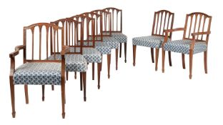 A set of eight mahogany and upholstered dining chairs in George III style