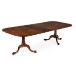 A mahogany twin pedestal dining table in George III style
