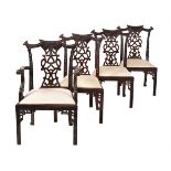 A set of eight carved hardwood dining chairs in George III style