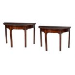 A pair of early George III mahogany side tables