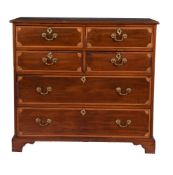 A mahogany and marquetry inlaid chest of drawers