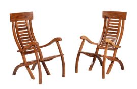 A pair of hardwood folding steamer chairs