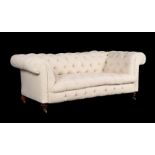 A Victorian walnut and cream linen upholstered sofa