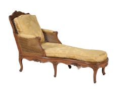 A carved walnut day bed