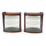 A pair of Victorian mahogany and glazed hanging display cabinets