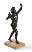 A green patinated bronze figure of The Dancing Faun of Pompeii