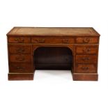 A walnut pedestal desk