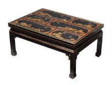 A black laquered and gilt decorated low centre table