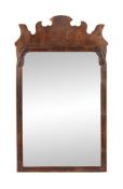 A George II walnut fret-framed wall mirror