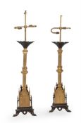 A pair of gilt and patinated metal table lamps in Regency Gothic revival taste