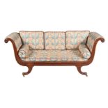 A mahogany and upholstered sofa in Regency taste