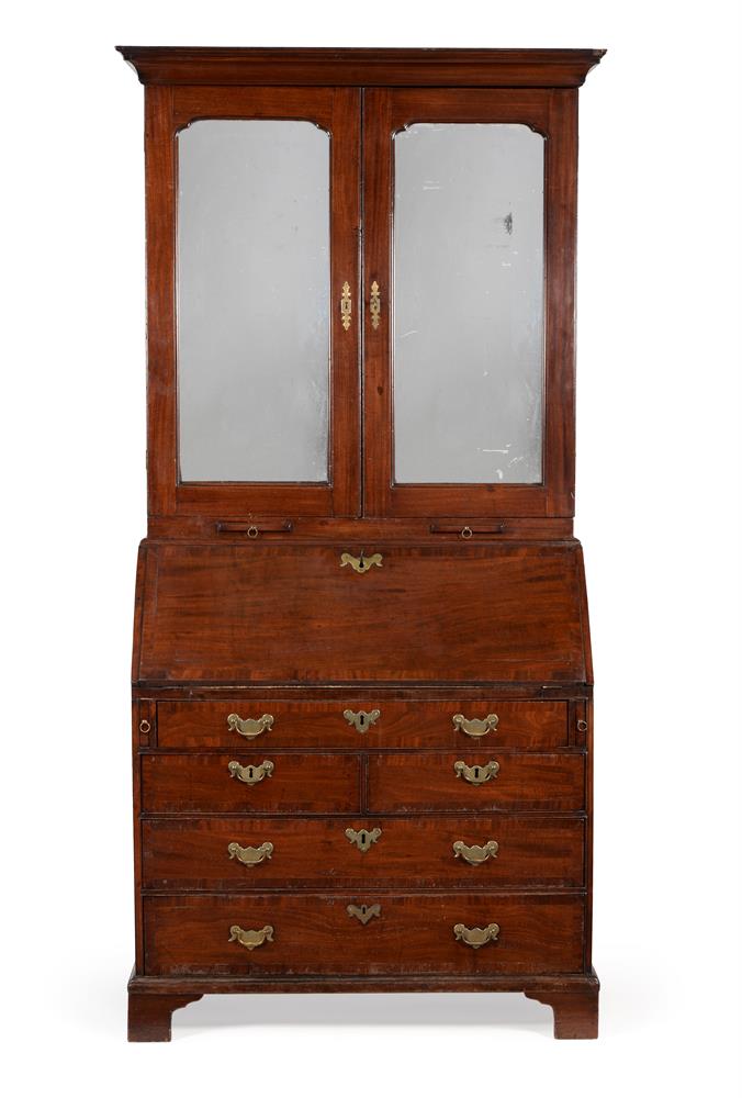 A George II mahogany and crossbanded bureau cabinet