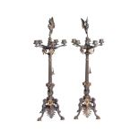 A pair of French patinated and gilt bronze five light candelabra in Neoclassical style