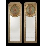 A pair of Continental grey painted and parcel gilt wall mirrors