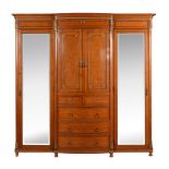 Y A French satinwood, tulipwood banded, and gilt metal mounted compactum wardrobe