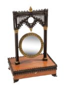 A satinwood, bronze and gilt bronze mounted table mirror in the Gothic manner