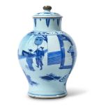 A TRANSITIONAL CHINESE BLUE AND WHITE BALUSTER VASE AND COVER17TH CENTURYPainted with court figure