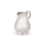 AN EARLY GEORGE II SILVER BALUSTER CREAM JUG BY GEORGE WICKES