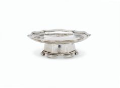 AN ARTS AND CRAFTS HAMMERED SILVER SHAPED CIRCULAR SMALL STAND OR FOOTED WAITER BY OMAR RAMSDEN