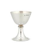 AN ARTS AND CRAFTS HAMMERED SILVER SMALL GOBLET BY OMAR RAMSDEN