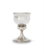 AN ARTS AND CRAFTS HAMMERED SILVER GOBLET BY OMAR RAMSDEN