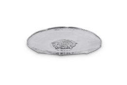 AN ARTS AND CRAFTS HAMMERED SILVER SHAPED CIRCULAR DISH BY OMAR RAMSDEN