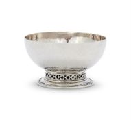 AN ARTS AND CRAFTS HAMMERED SILVER SMALL CIRCULAR BOWL BY OMAR RAMSDEN