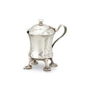 AN ARTS AND CRAFTS HAMMERED 'CYMRIC' SILVER MUSTARD POT BY LIBERTY & CO.