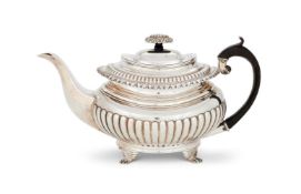 AN INDIAN COLONIAL SILVER OBLONG BALUSTER TEA POT BY HAMILTON & CO.