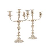 A PAIR OF VICTORIAN SILVER CANDLESTICKS BY ROBERT GARRARD II AND LATER CANDELABRA BRANCHES