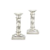 A PAIR OF CHINESE EXPORT SILVER CANDLESTICKS BY WANG HING & CO.