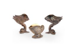 A PAIR OF SILVER GILT SHELL PEDESTAL SALT CELLARS BY RICHARD COMYNS