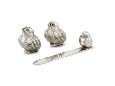 A PAIR OF EDWARDIAN SILVER NOVELTY CHICK PEPPERETTES BY SAMPSON MORDAN & CO.