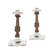 A PAIR OF ARTS AND CRAFTS HAMMERED SILVER AND WOOD SQUARE CANDLESTICKS BY A.E. JONES (ALBERT EDWARD