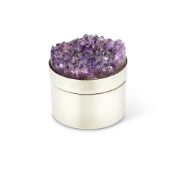A SILVER CYLINDRICAL BOX WITH AN AMETHYST GEODE COVER BY STUART DEVLIN