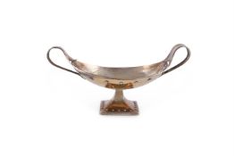 AN ARTS AND CRAFTS HAMMERED SILVER GILT OVAL PEDESTAL BOWL BY A.E. JONES (ALBERT EDWARD JONES)