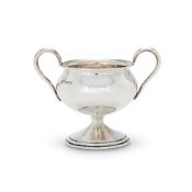 AN ARTS AND CRAFTS HAMMERED SILVER TWIN HANDLED CUP BY OMAR RAMSDEN
