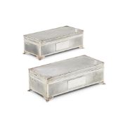 A MATCHED PAIR OF SILVER RECTANGULAR CIGARETTE BOXES BY HARMAN BROTHERS