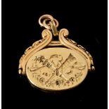 A FRENCH LATE 19TH CENTURY GOLD SWIVEL LOCKET FOB