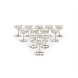 A CASED SET OF TWELVE SILVER CHAMPAGNE GOBLETS BY WALKER & HALL