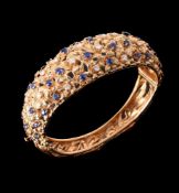 AN 18 CARAT GOLD SAPPHIRE AND DIAMOND HINGED BANGLE SIGNED VAN GOGH