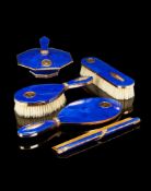A FRENCH SILVER GILT AND GOLD COLOUR MOUNTED LAPIS LAZULI FIVE PIECE DRESSING TABLE SET