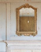 A GILTWOOD WALL MIRROR IN GEORGE II STYLE, LATE 19TH/EARLY 20TH CENTURY