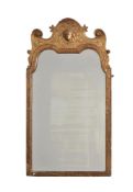 A GEORGE I CARVED GILTWOOD AND GESSO WALL MIRROR, ATTRIBUTED TO JOHN BELCHIER, CIRCA 1720