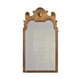 A GEORGE I CARVED GILTWOOD AND GESSO WALL MIRROR, ATTRIBUTED TO JOHN BELCHIER, CIRCA 1720