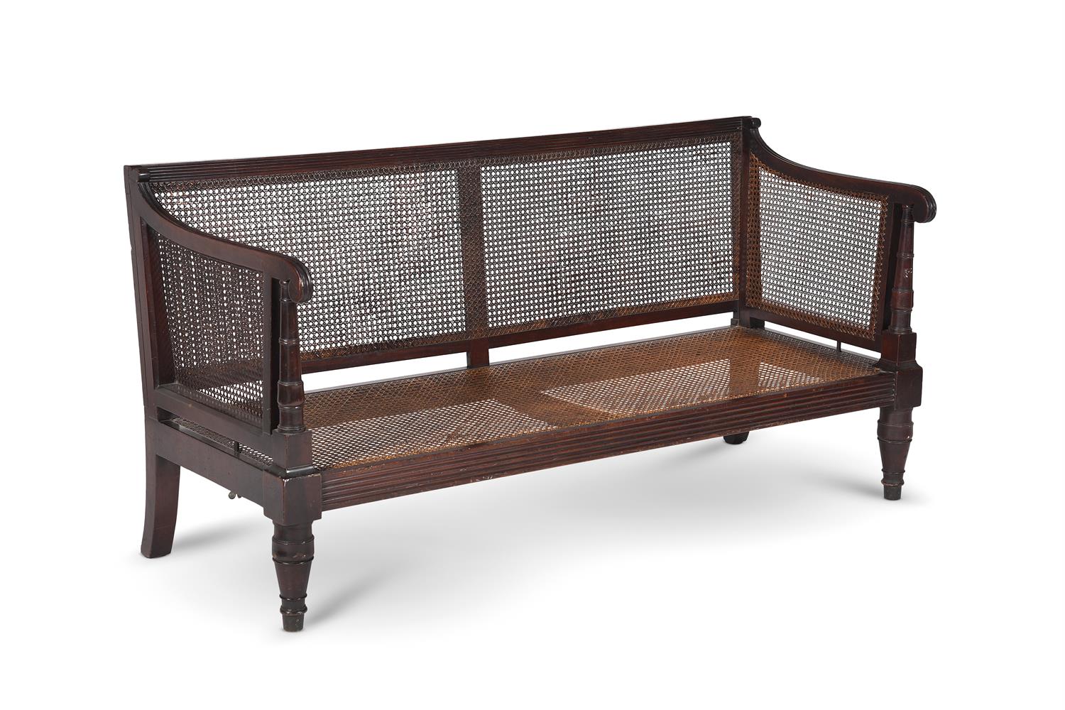 A REGENCY MAHOGANY AND CANED BERGÈRE SETTEE, IN THE MANNER OF WILLIAM TROTTER, CIRCA 1815