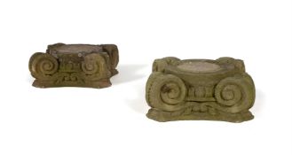 A PAIR OF SCULPTED LIMESTONE IONIC ORDER CAPITALS, LATE 18TH OR EARLY 19TH CENTURY