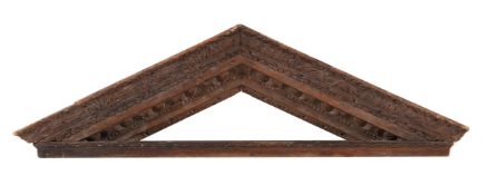 A GEORGE II CARVED PINE DOOR PEDIMENT, IN THE MANNER OF WILLIAM KENT, CIRCA 1740