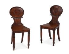 A PAIR OF GEORGE IV MAHOGANY HALL CHAIRS, IN THE MANNER OF GILLOWS, CIRCA 1825